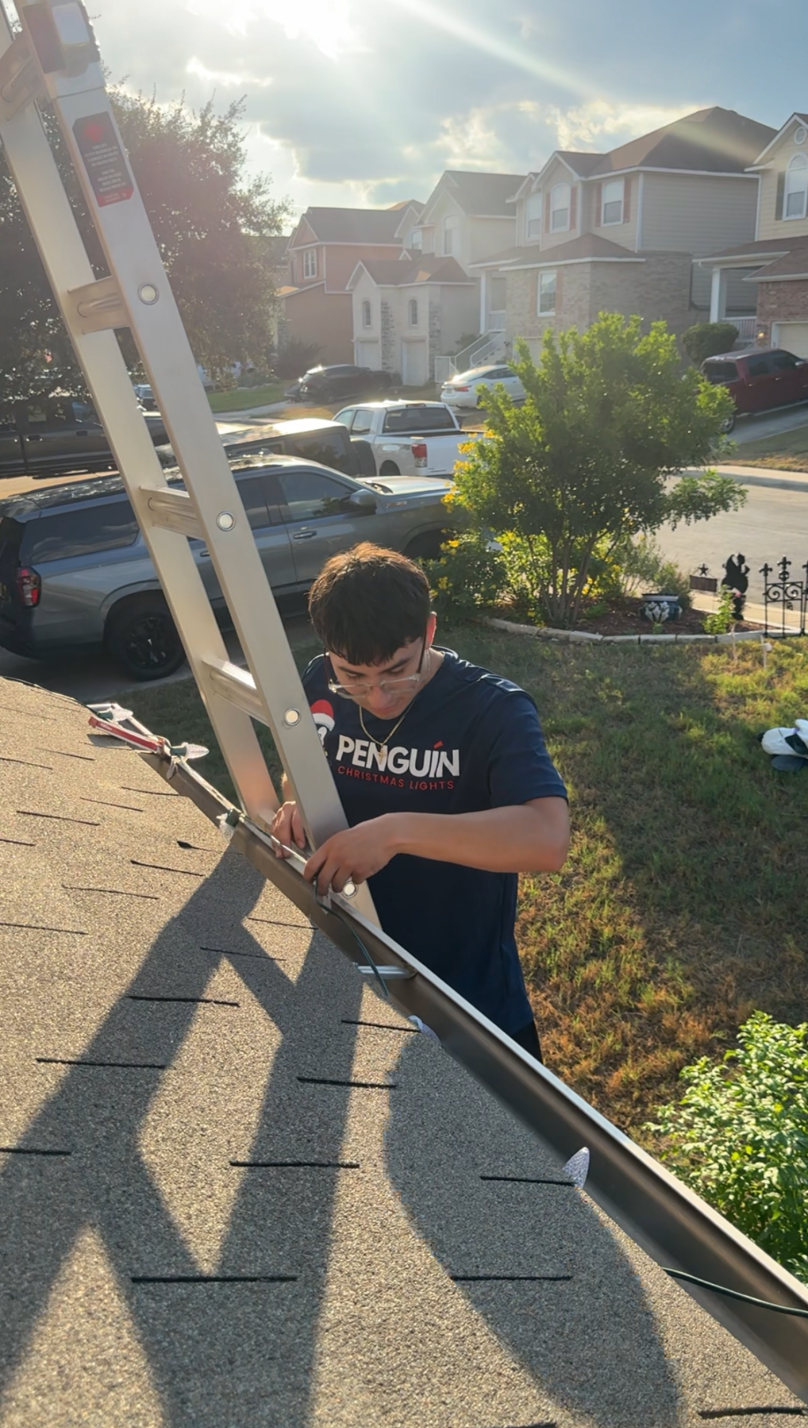 Penguin Christmas Lights crew installing Christmas lighting