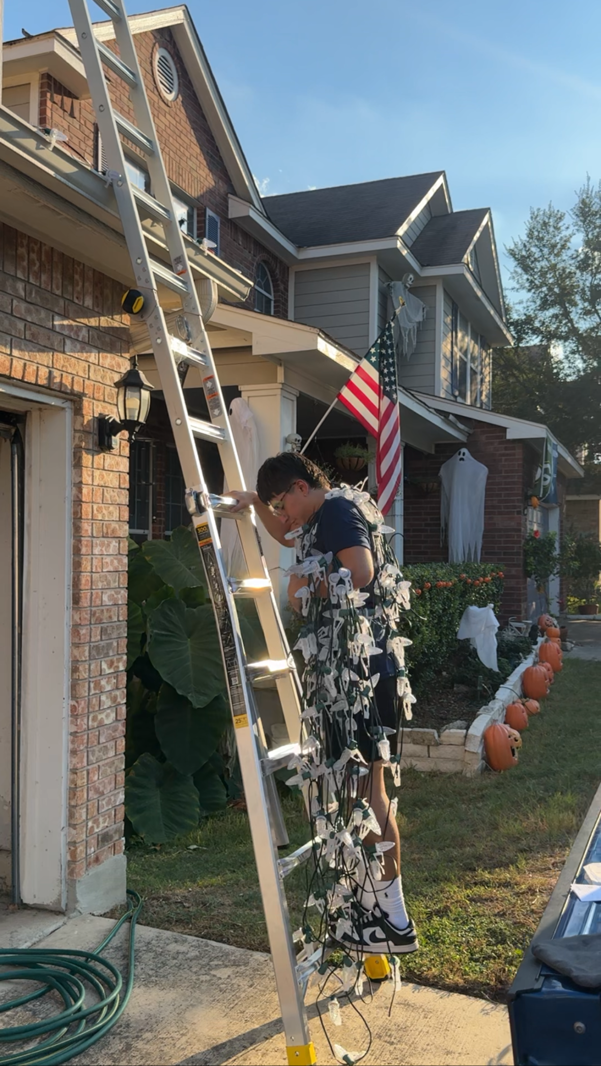 Penguin Christmas Lights crew installing Christmas lighting