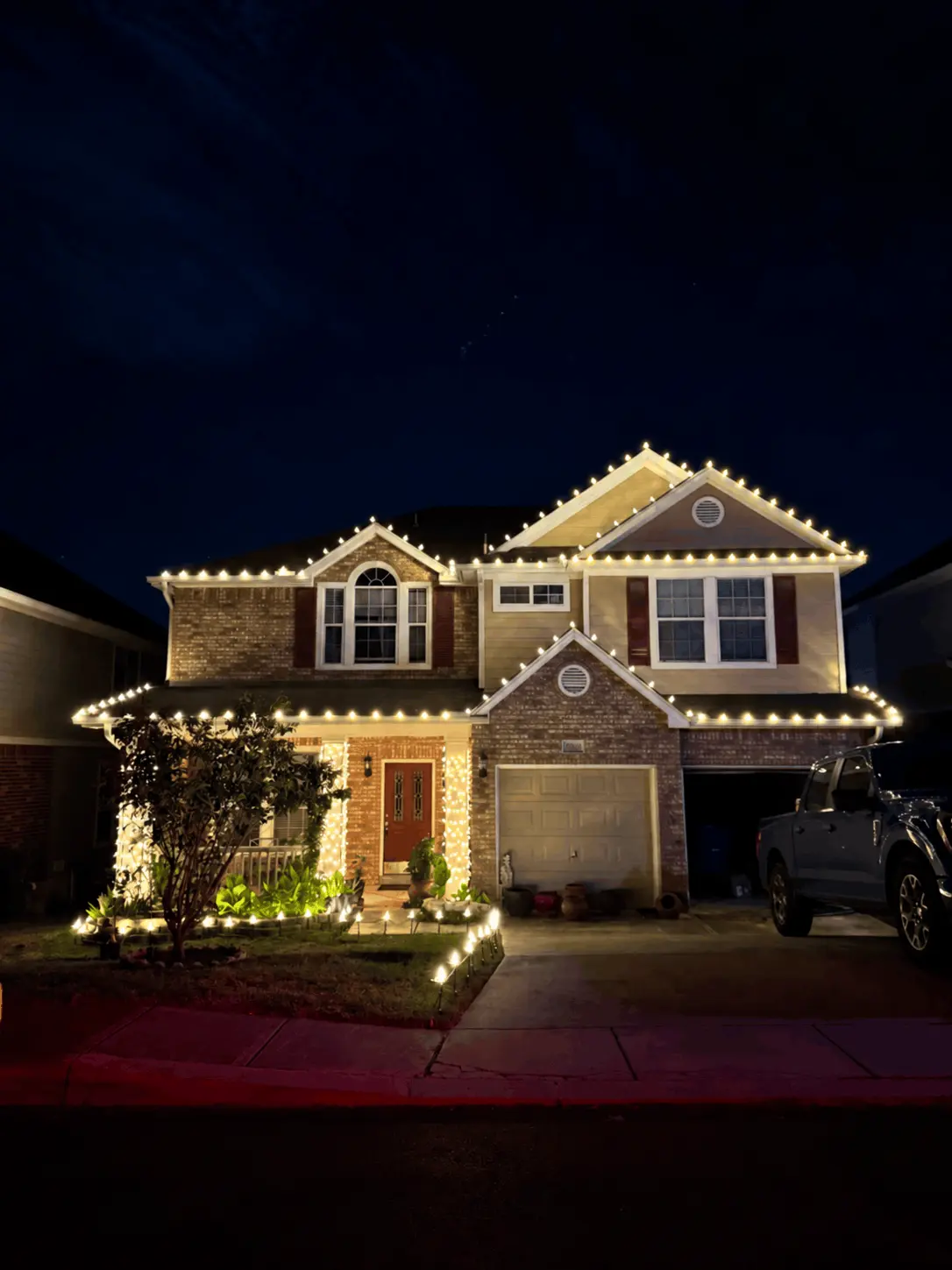 Home decorated with Christmas lights by Penguin Christmas Lights